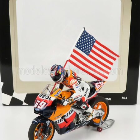 MINICHAMPS 1/12 HONDA | RC211V N 69 MOTOGP NICKY HAYDEN 2006 WORLD CHAMPION - WITH FIGURE AND FLAG | BLACK ORANGE YELLOW